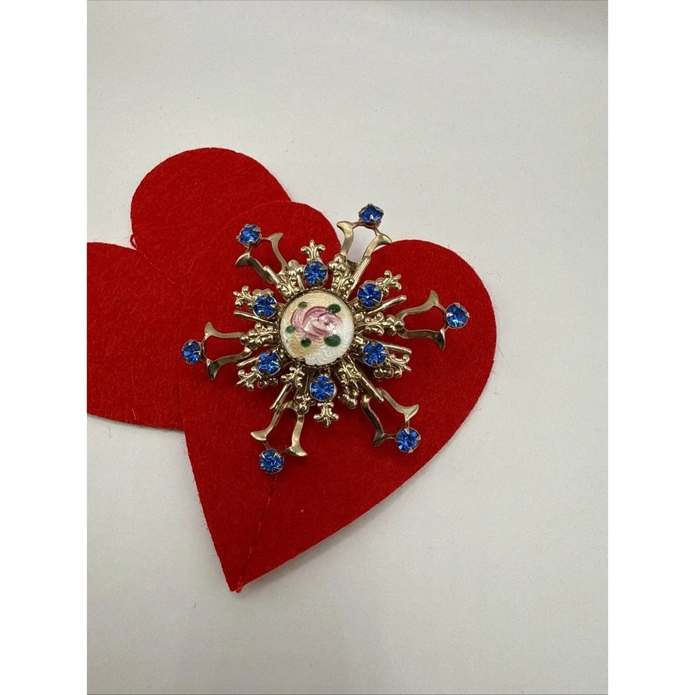Gold-toned rhinestone starburst brooch floral enamel design blue rhinestones.‎